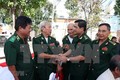 山萝省和老挝乌多姆赛省交换老兵活动经验