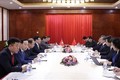 越南政府副总理兼外长范平明在老挝会见中国国务委员兼外长王毅