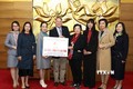 越南—加拿大友好协会举行河内关爱儿童慈善义跑善款支票移交仪式