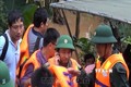 Hình ảnh Thiếu tướng Nguyễn Văn Man (người nghe điện thoại, đứng thứ hai từ phải qua) đội mưa, lội nước, trực tiếp có mặt tại hiện trường chỉ huy công tác ứng cứu trong thiên tai bão lũ để lại nhiều xúc động, khâm phục và tự hào trong ký ức mỗi cán bộ, ch