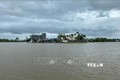 Một khu dân cư ở xã Phước Thắng (huyện Tuy Phước, Bình Định) bị nước lũ cô lập. Ảnh: Tường Quân - TTXVN