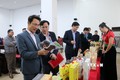 Phó Chủ tịch UBND tỉnh Lai Châu Hà Trọng Hải (người đầu tiên, bên trái) tham quan các sản phẩm OCOP trưng bày tại buổi đánh giá, chấm sản sản phẩm OCOP của tỉnh năm 2022. Ảnh: Việt Hoàng - TTXVN