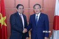 越共中央组织部部长、越日友好议员小组组长会见日本首相菅义伟