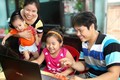 “家庭——温馨港湾”图片展推崇越南家庭的价值