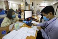 越南全国1280万名受疫情影响的劳动者获得失业保险基金的资金支持