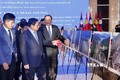 越南政府总理和老挝政府总理参观越老双方合作成就图片展