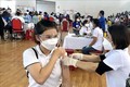 Cán bộ, giáo viên ngành giáo dục thành phố Quy Nhơn tiêm vaccine ngừa COVID-19. Ảnh: Nguyên Linh-TTXVN