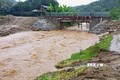 Nước lũ tràn về dòng suối trên địa bàn xã Bình Thuận, huyện Văn Chấn.Ảnh: TTXVN phát
