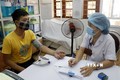 Khám chữa bệnh tại Bệnh viện đa khoa huyện Bảo Yên. Ảnh: Quốc Khánh - TTXVN
