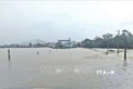 Nước lũ gây ngập các tuyến đường tại phường Nhơn Hưng, thị xã An Nhơn. Ảnh: TTXVN phát