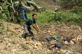 Cơ quan Công an dựng lại hiện trường vụ K'Hài sát hại con rể. Ảnh: cand.com.vn