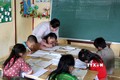 Giờ học của học sinh ghép lớp 2 và 3 tại điểm trường Séo Trung Hồ Mông, xã Bản Hồ (Sa Pa). Ảnh tư liệu: Quốc Khánh/TTXVN
