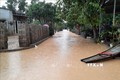 Nhiều tuyến đường giao thông nông thôn ở Quảng Trị vẫn bị ngập sâu trong nước. Ảnh: Hồ Cầu-TTXVN
