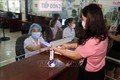Người dân sử dụng thẻ BHYT điện tử trên ứng dụng VssID để đăng ki khám bệnh tại Bệnh viện Đa khoa tỉnh Sơn La. Ảnh: Hữu Quyết – TTXVN