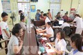 Người dân có thẻ BHYT  làm thủ tục  khám, chữa bệnh tại Bệnh viện đa khoa tỉnh Sơn la. Ảnh: Hữu Quyết - TTXVN