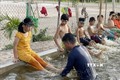 Lớp bơi dành cho trẻ khuyết tật tại xã Hải Hưng, huyện Hải Lăng. Ảnh: Thanh Thủy-TTXVN
