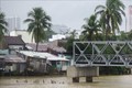 Mưa lớn kéo dài nước lũ sông  dâng cao gây ngập lụt tại một số khu dân cư. Ảnh: Phạm Cường - TTXVN