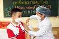 Tiêm vaccine cho học sinh lớp 6. Ảnh: Văn Đức - TTXVN
