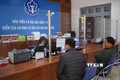 Người dân đến trụ sở của Bảo hiểm xã hội Việt Nam tại huyện Tam Đường (Lai Châu) tham gia BHYT. Ảnh: Quý Trung – TTXVN