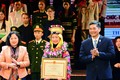 Nữ sinh Sùng Thị Vân trong trang phục truyền thống của đồng bào dân tộc Lô Lô tại Lễ tuyên dương học sinh, sinh viên, thanh niên dân tộc thiểu số xuất sắc tiêu biểu toàn quốc năm 2023 do Ủy ban Dân tộc tổ chức. Ảnh: Song Hùng