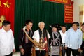 Tổng Bí thư Nguyễn Phú Trọng thổi khèn Mông tại xã Bản Bo, huyện Tam Đường vào tháng 7/2016. Ảnh: TTXVN phát