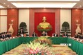越共中央政治局与越共第十二届原中央政治局委员、书记处书记和中央委员举行见面会