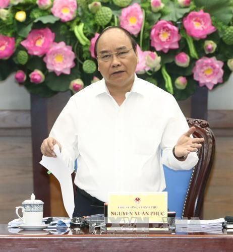 阮春福总理：政府及直属机构应继续与企业同行