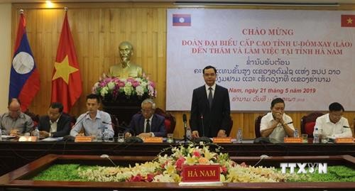大力推动越南河南省与老挝乌多姆塞省的合作