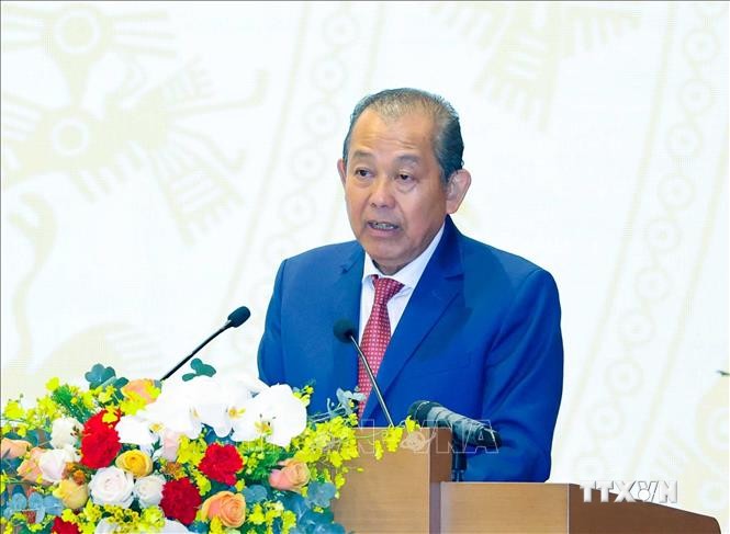 Phó Thủ tướng Thường trực Trương Hoà Bình trình bày báo cáo tóm tắt về tình hình thực hiện kế hoạch phát triển KT - XH năm 2020 và 5 năm 2016 - 2020, dự kiến nhiệm vụ thời gian tới. Ảnh: Thống Nhất – TTXVN