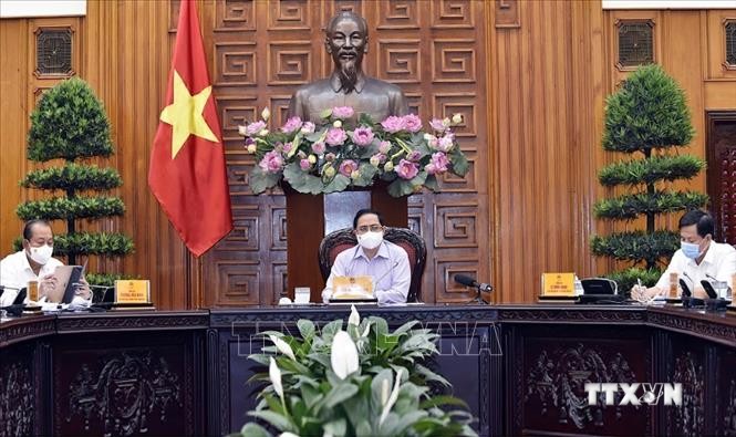Thủ tướng Phạm Minh Chính chủ trì cuộc họp Thường trực Chính phủ về công tác tổ chức bầu cử trong bối cảnh dịch bệnh COVID-19. Ảnh : TTXVN