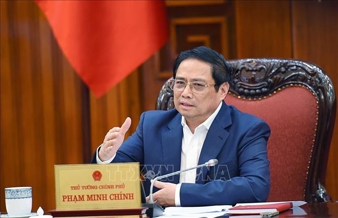 越南政府总理范明政：促进颁布有关债务重组和公司债券的两项通知
